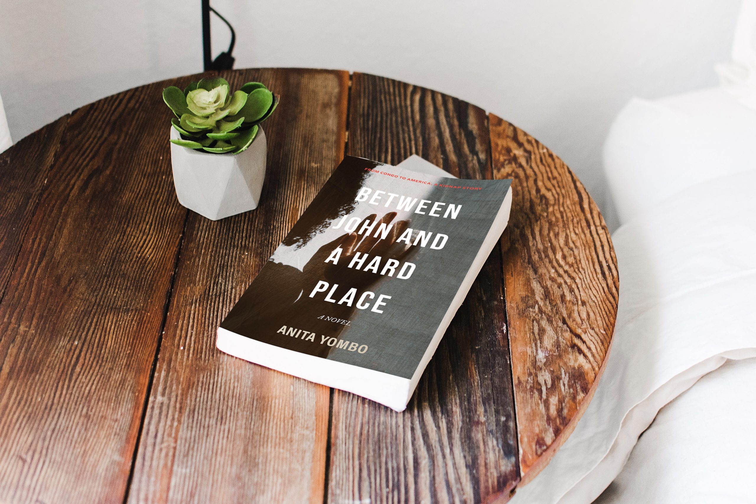 Book Review - Between John and a Hard Place by Anita Yombo